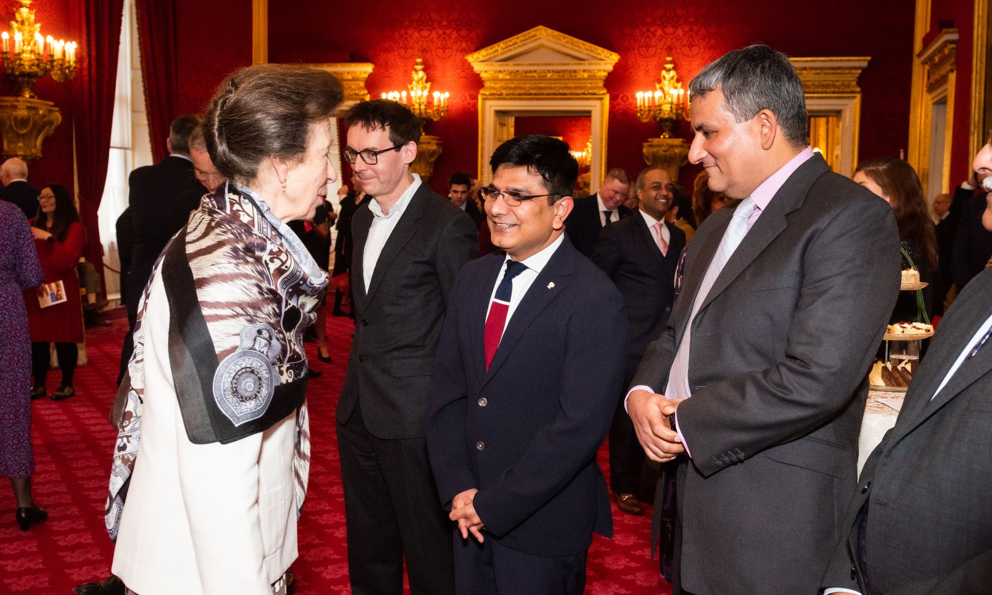 Dr Ashok Tahilyani speaking with Her Royal Highness The Princess Royal inside St James Palace.