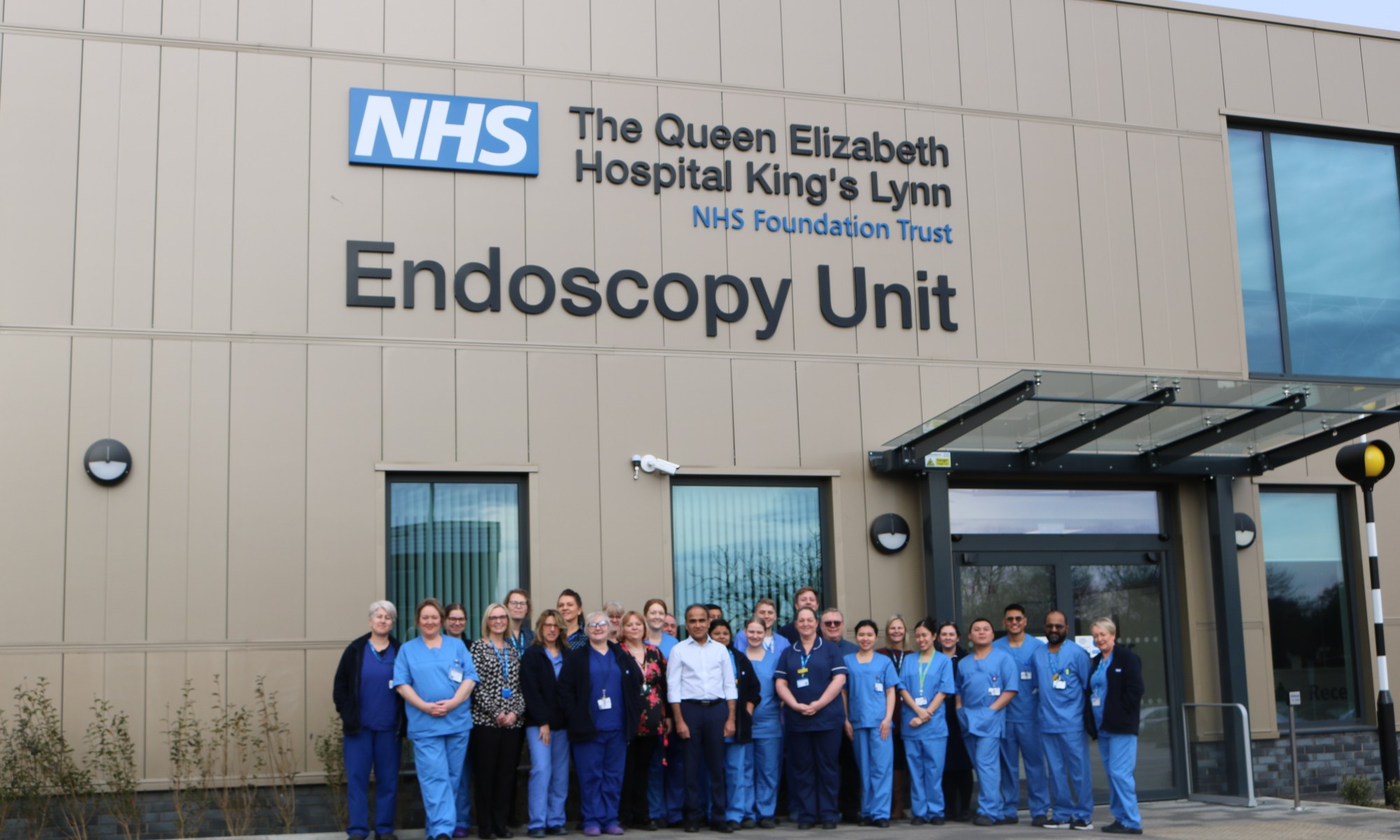 Clinical team standing outside QEH Endoscopy Unit.