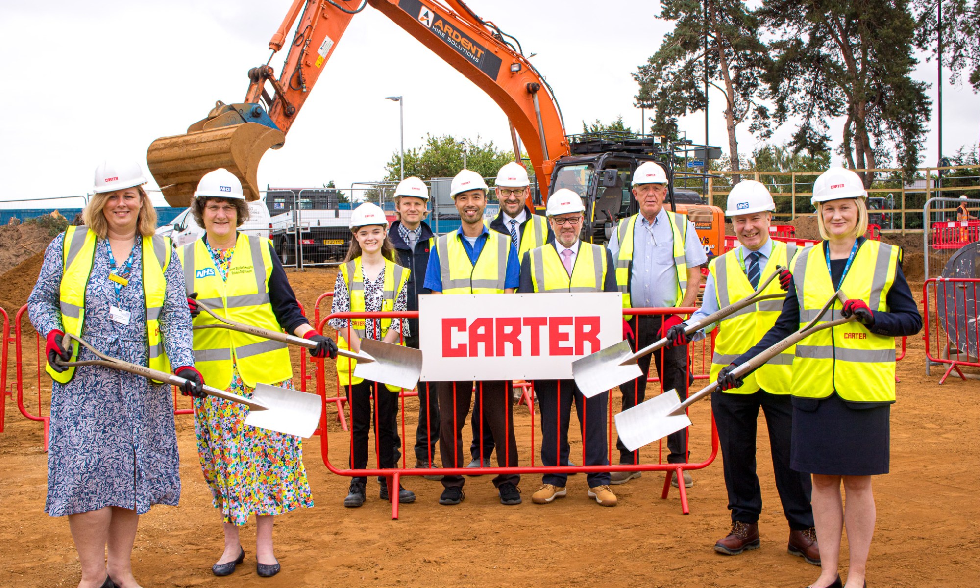 QEH staff and R G Carter staff on the site cleared for the new DAC building.