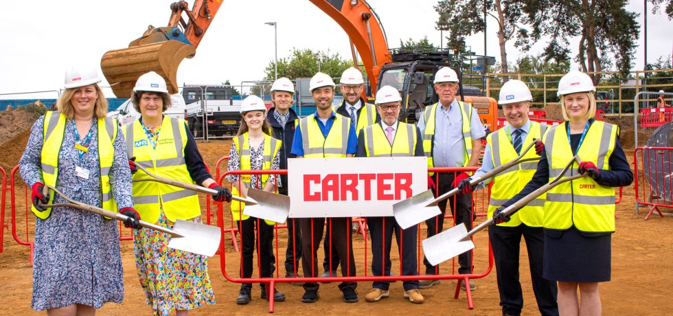 QEH staff and R G Carter staff on the site cleared for the new DAC building.