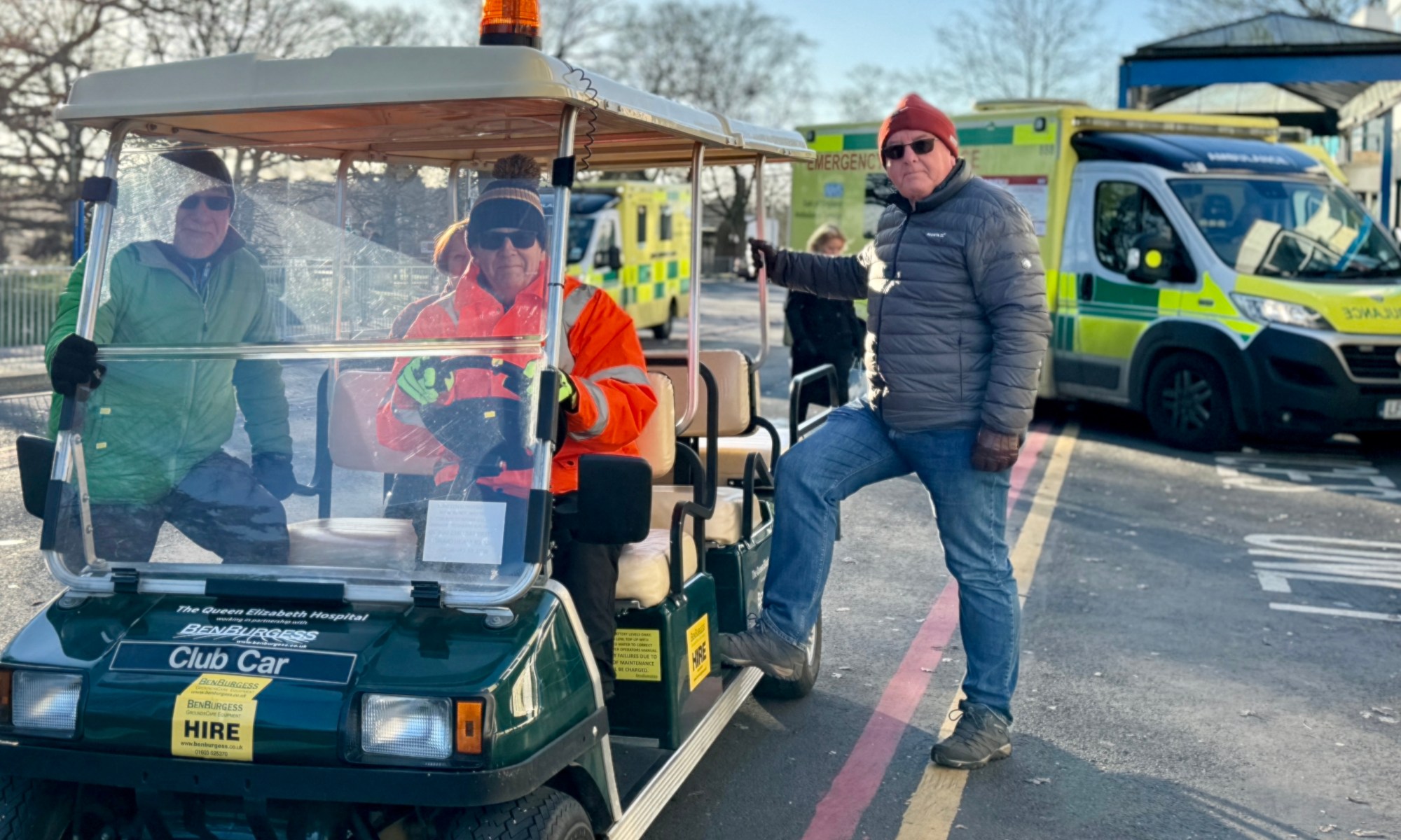 The QEH patient buggy in use at the front of the hospital