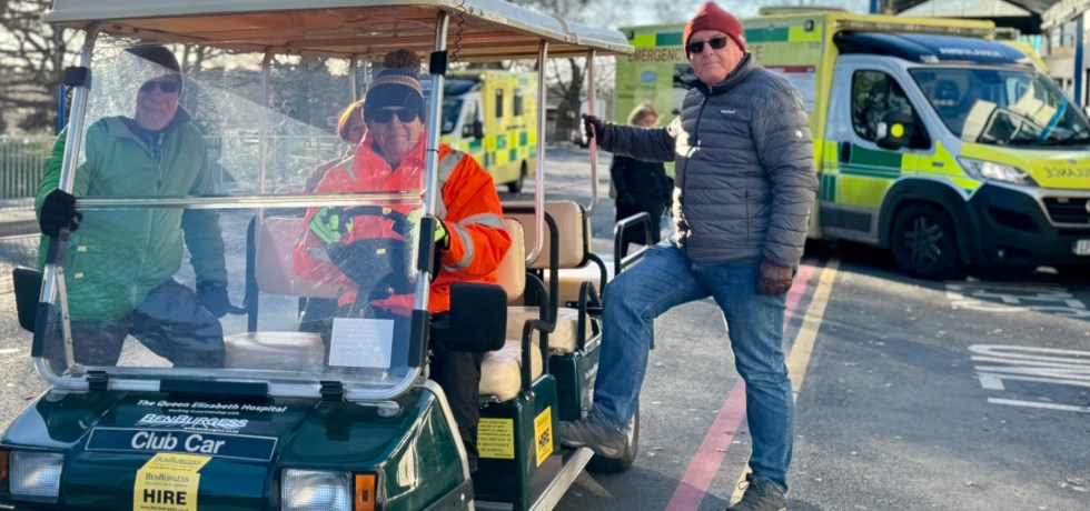 The QEH patient buggy in use at the front of the hospital