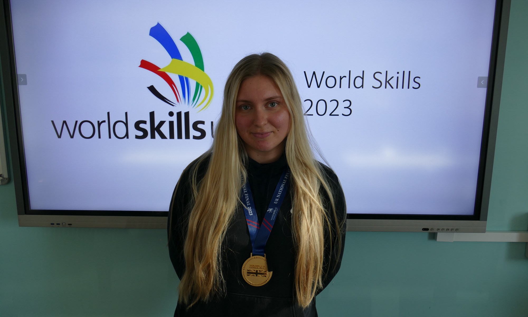 Molly Hewitt wearing her gold medal awarded at the Worldskills competition