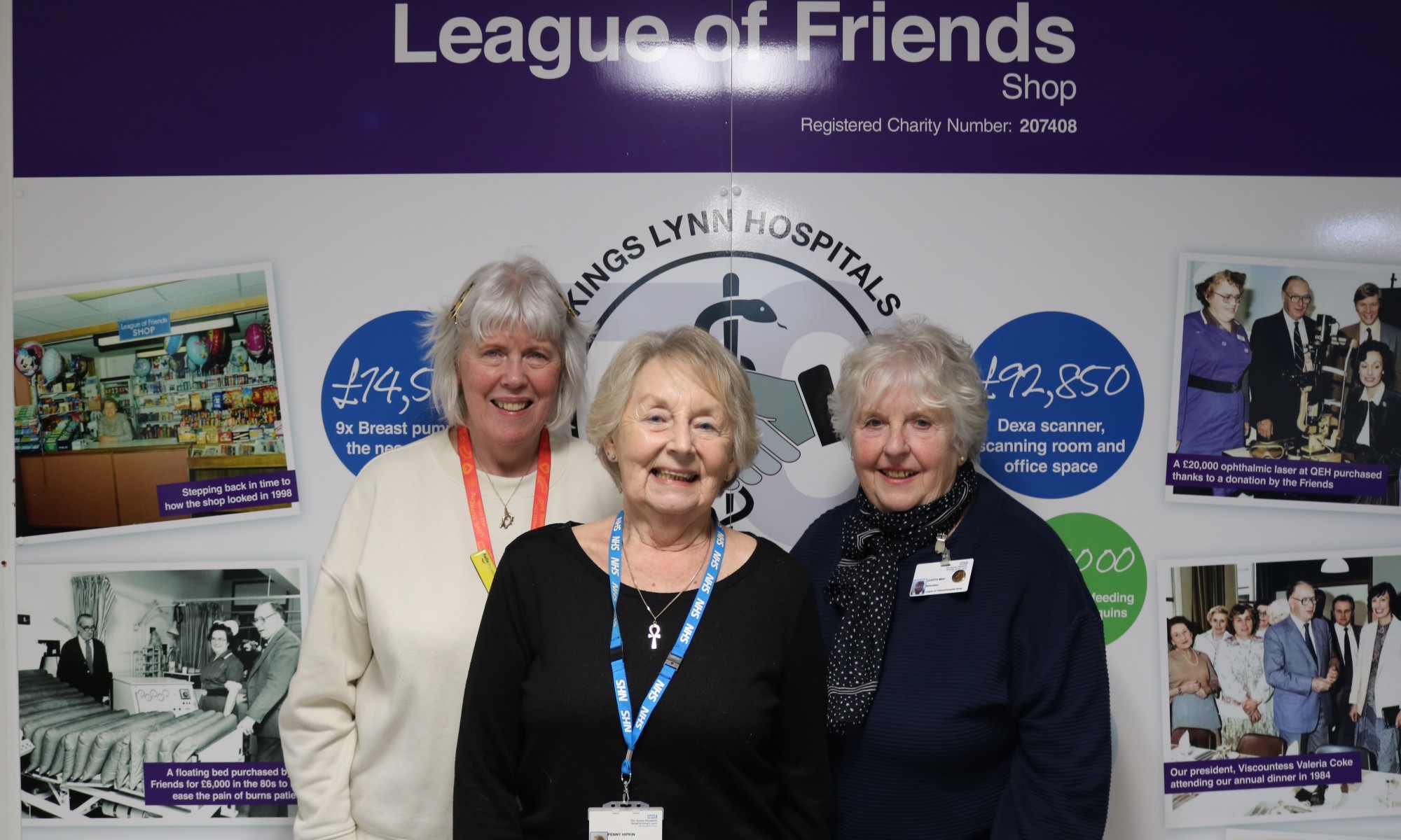A picture of Marie Long, Penny Hipkin and Judy May standing in front of The League of Friends shop.