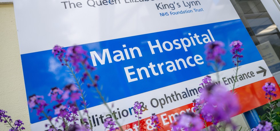 a sign outside the hospital indicating main entrance