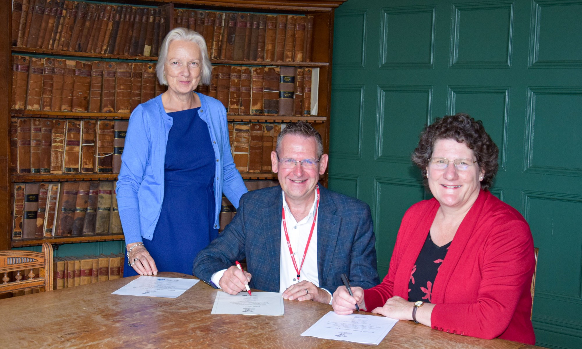 Image showing Lorraine Gore, David Pomfret and Alice Webster at a signing ceremony