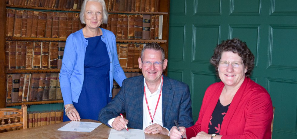 Image showing Lorraine Gore, David Pomfret and Alice Webster at a signing ceremony
