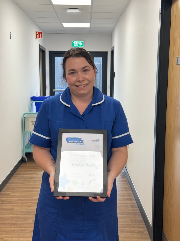 Natalie Taylor with her Living Our Values certificate 