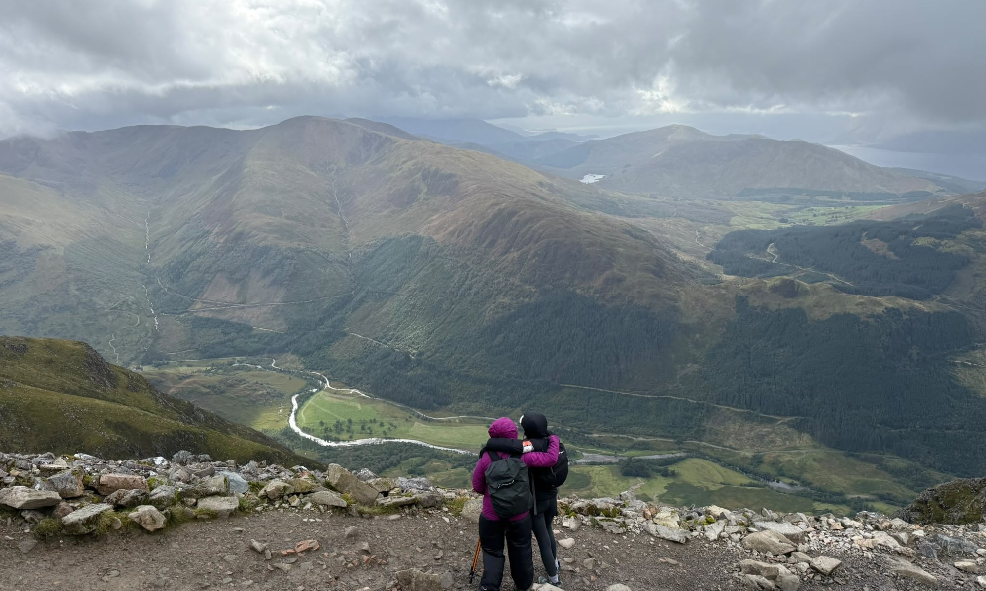 Janet Mick is in the pink coat and Anna Bamford (Jan’s sister-in-law) looking over the beautiful scenery