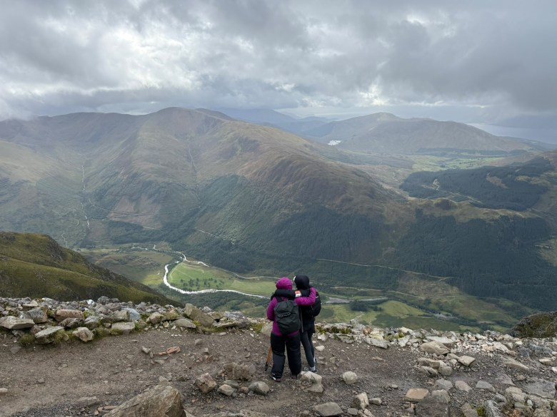 Janet Mick is in the pink coat and Anna Bamford (Jan’s sister-in-law) looking over the beautiful scenery